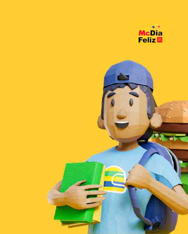 Uma figura de desenho animado com boné e camiseta azuis segura livros e uma mochila, com um hambúrguer atrás deles. O fundo é amarelo, trazendo no canto superior direito a logomarca “McDia Feliz”, apoiando orgulhosamente o Instituto Ayrton Senna.