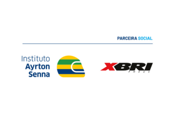 A imagem exibe os logotipos do Instituto Ayrton Senna e da XBRI Pneus, com o título "PARCEIRA SOCIAL" acima deles.