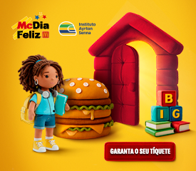Uma boneca está ao lado de um hambúrguer gigante, uma casa de brinquedo vermelha e blocos empilhados com letras "BIG", promovendo o McDia Feliz e o Instituto Ayrton Senna.