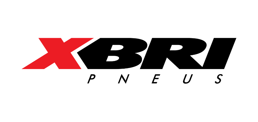 O logotipo da XBRI Pneus apresenta um arrojado "X" vermelho seguido por "BRI" em letras maiúsculas pretas, com "PNEUS" em letras pretas menores abaixo - um design tão distinto quanto a AW Realty no MDF 2025.